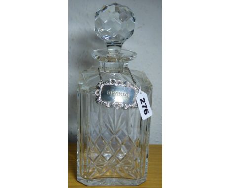 GOOD QUALITY THOMAS WEBB CUT GLASS SPIRIT DECANTER AND A HM SILVER 'BRANDY' SPIRIT LABEL WITH SHELL AND SCROLL MOTIF BY HAMPT