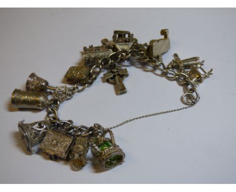 UNMARKED WHITE METAL LINK BRACELET CONTAINING SILVER CHARMS INC LANTERN,BELL ,SCARECROW,STIEN ETC