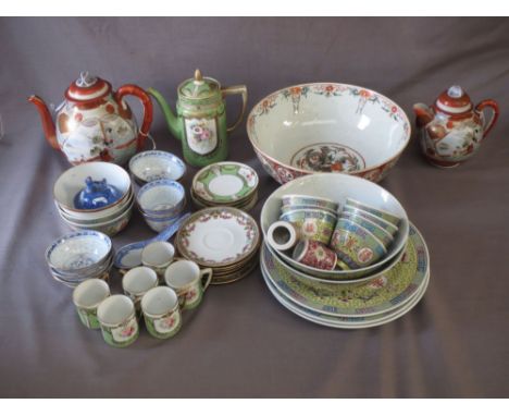 A group of porcelain wares, comprising a Japanese Imari bowl, two Japanese teapots and covers, a set of European tea service 