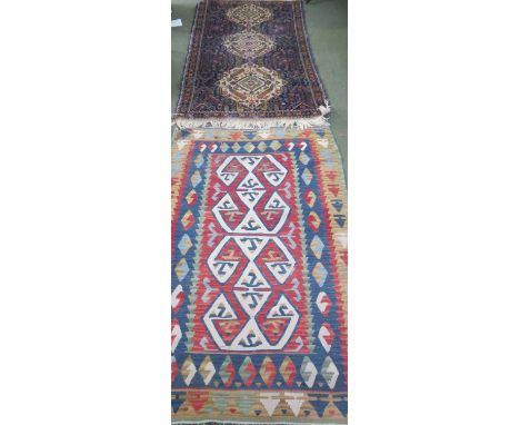 Small Kelim carpet with central stylised cream shapes and terracota and red border designs 175 cm x 109 cm and Persian rug wi