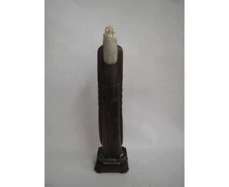 Hardwood and ivory figure of a bearded Chinese man, the carved base with cloisonnÚ enamel surround 75 cm H Good general condi