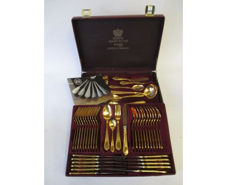 Solingen model Granada gold plated ten person canteen comprising of knives, forks, spoons and serving spoons in fitted case I