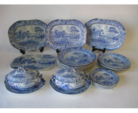 Spode and Copeland & Garret C19th blue and white part dinner service, three oblong dishes, drainers, two gravy tureens on sta