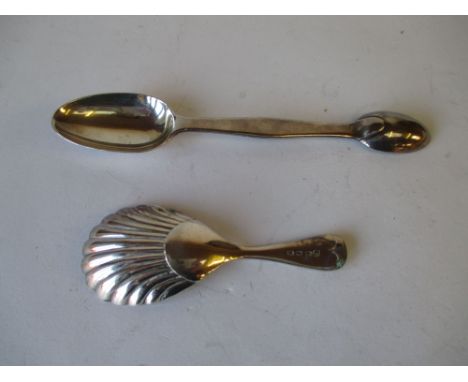 Hallmarked silver caddy spoon and a hallmarked silver medicine spoon.  Well used, showing signs of wear