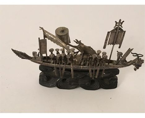  Chinese silver model of a junk with sales and figures with oars wood carved base approx 17 cm long 10 cm tall . this item is