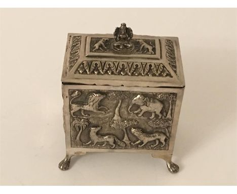  Indian tea caddy  has embossed panel of wild animals  not hallmarked  but acid tested silver weight 203 g measures approx 10