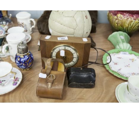 A PAIR OF OPERA GLASSES IN CASE, A PAIR OF MILITARY HAIR BRUSHES, IN CASE, MAINS ELECTRIC MANTEL CLOCK, IN OAK CASE 