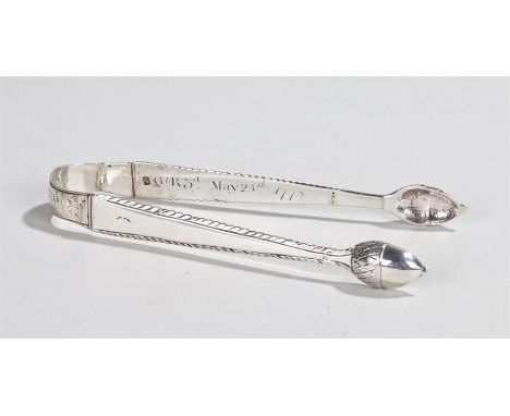 Pair of Georgian silver sugar tongs, with acorn form terminals, inscription to inside of arm "G R 3rd May 25th 1778", the han