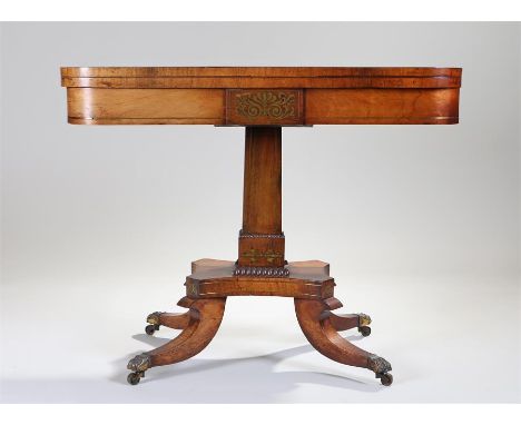 Regency rosewood and brass inlaid card table, the rectangular top with inlaid leaf swag decoration opening to reveal a playin