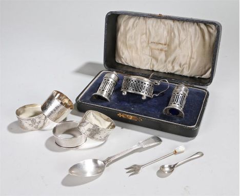 Silver, various dates and makers, to include a cruet set, a spoon, a fork and three napkin rings, (qty)