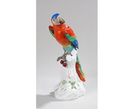 Meissen porcelain parrot, the parrot clutching cherries above a trunk base, the internal base with cross sword mark, numbered