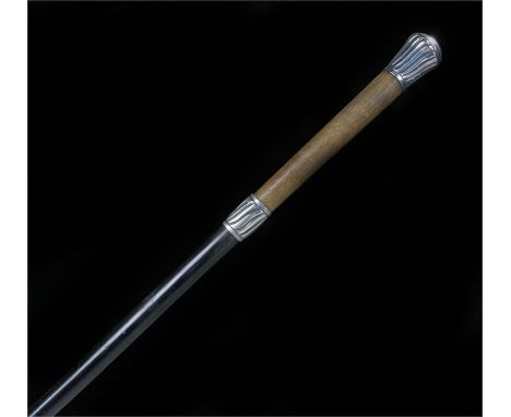 Victorian walking stick, possibly rhinoceros horn handle with gadrooned white metal mounts and ebonized shaft, length 98.5cm