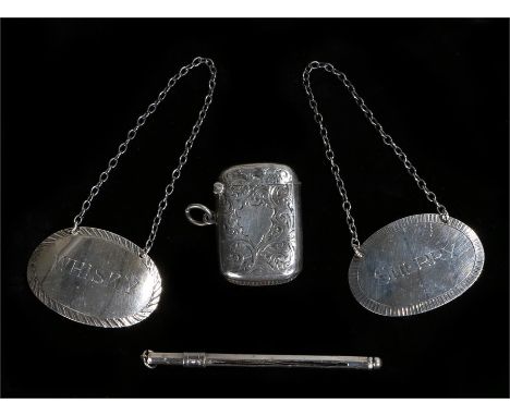 Silver, various dates and makers, to include a vesta case, two decanter labels for sherry and whisky, swizzle stick, 1.5oz (4