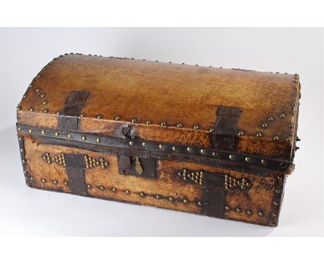 Early 19th Century leather clad trunk, the arched top with iron fittings, stud work decoration, 62cm wide