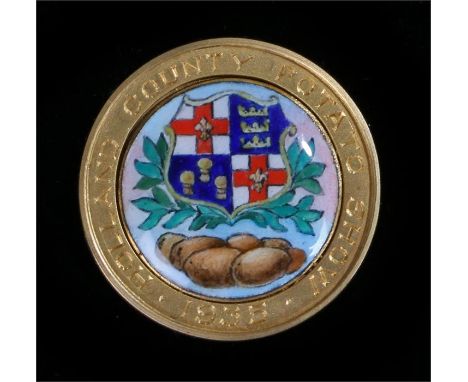 9 carat gold trophy medallion, engraved "Holland County Potato Show 1935" with central enamel panel decorated with a coat of 