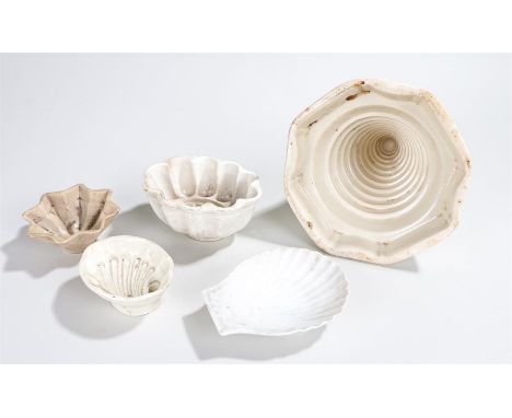 Four Victorian moulds to include an ice cream mould, a Spode star shaped example, shell example and a flower example also a s