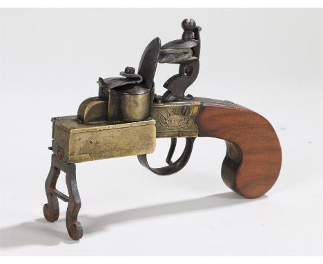 18th Century brass and walnut tinder light, Bass London, the brass fitting with a side compartment and iron lock, 15.5cm long