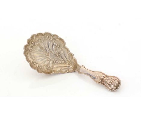 A Victorian silver caddy spoon, with a hollow stem and stamped decoration, maker's mark T.D., Birmingham 1851, 9.8cms long, 0