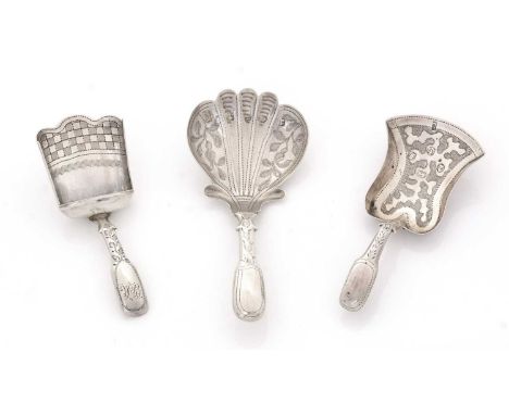 Three silver caddy spoons, with engraved decoration and hollow fiddle stems, one initialled, by various makers, mixed dates, 