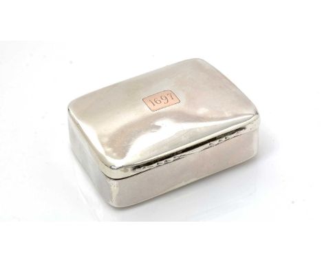 A silver Scottish Provincial snuff box, rectangular with rounded corners and a slightly domed cover inset with a gold cartouc