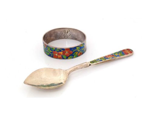 A George V silver napkin ring and spoon, decorated with polychrome enamel floral designs, the napkin ring initialled and date