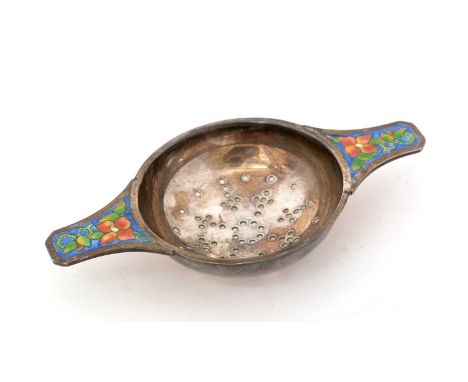 A George V silver tea strainer, with two lug handles, each decorated in polychrome enamel with a stylised flower, by Bernard 