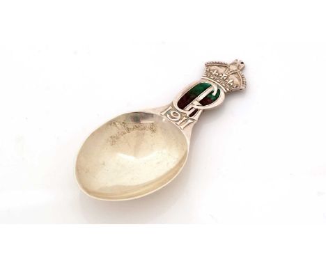 A George V silver coronation commemorative caddy spoon, with a 0plain egg-shaped bowl below the royal crown, the enamelled mo