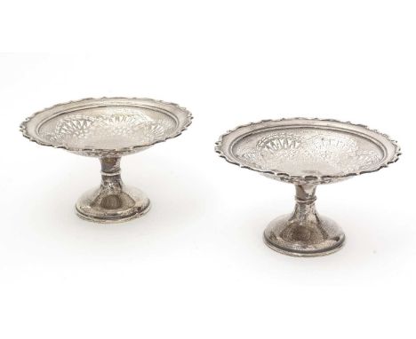 A pair of Edwardian silver tazze, with pierced dishes, shaped and moulded borders, by Barker Brothers, Chester 1909, 21cms di