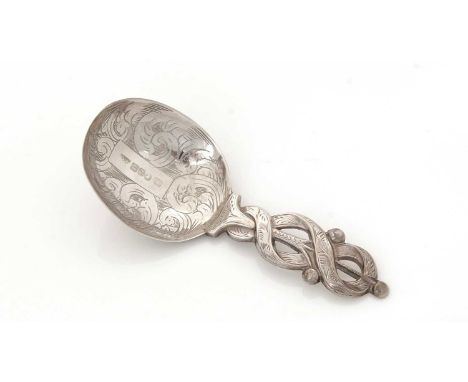 A Victorian silver engraved caddy spoon, with an openwork ribbon-like stem, by Francis Clarke, Birmingham 1848, 9.3cms long, 