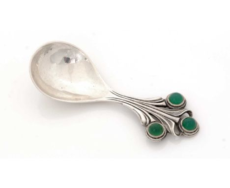 A George VI hand-made caddy spoon, with a hammered, drop-shaped bowl and an openwork stem in the form of a stylised flower, s