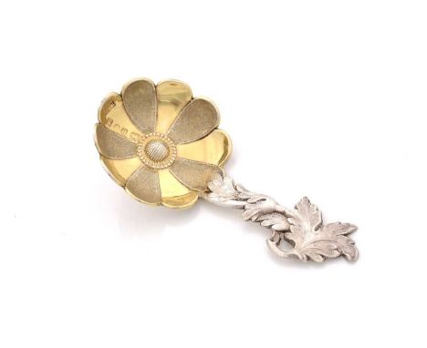 A Victorian parcel-gilt caddy spoon, in the form of an anemone flower, with a part malt and part polished bowl and leafy stem