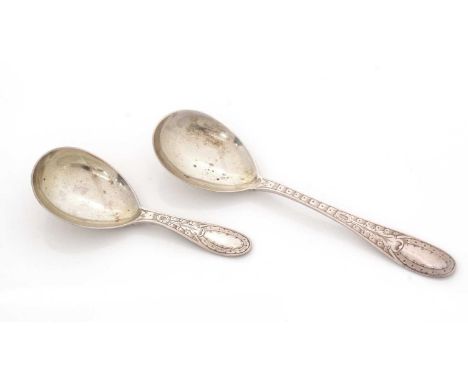 A Victorian silver Provincial caddy spoon and matching sugar spoon, with engraved stems, by Reid &amp; Sons of Newcastle 1863
