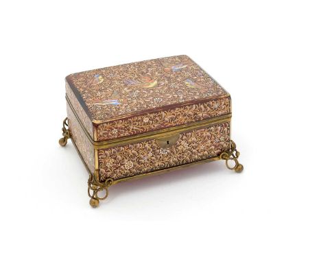 A late 19th Century Continental gilt-metal mounted cranberry coloured glass jewel casket, with coloured enamel overlay decora
