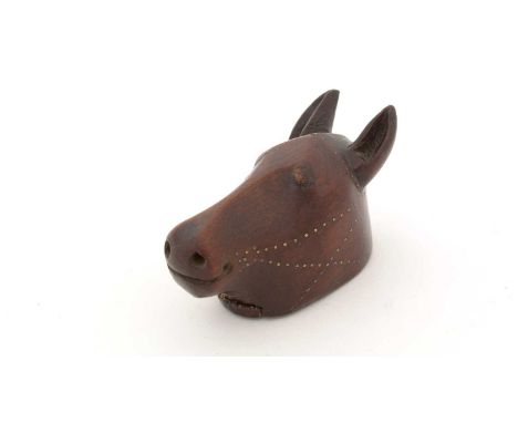 A 19th Century treen snuff box, carved in the form of a horse's head, with a slide-open cover and brass piqué-work reigns, 7.