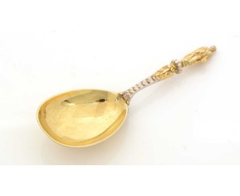 A Victorian parcel-gilt caddy spoon, with a drop-shaped bowl, decorated stem and a figure finial, by William Edwards, London 