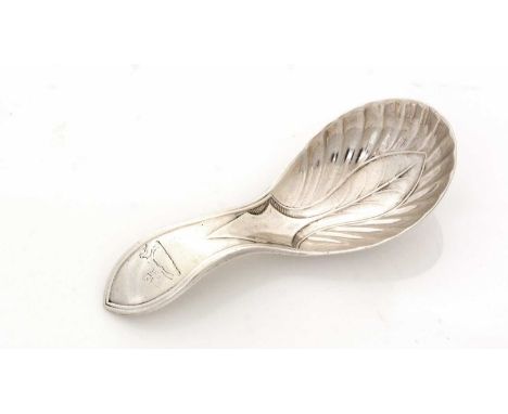 A George IV silver Provincial caddy spoon, stamped with a leaf design in the bowl and a pointed terminal, crested, by S.C. Yo