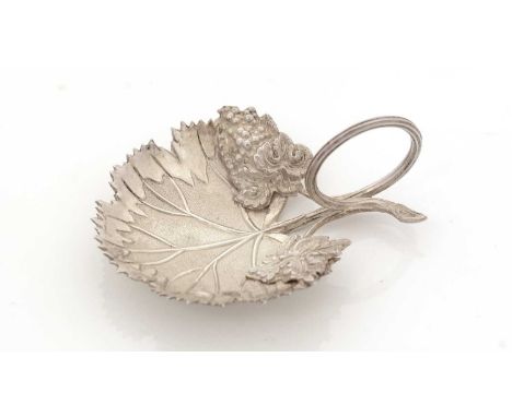 An early Victorian silver caddy spoon, in the form of a vine leaf with tendril ring handle, both matt and polished decoration