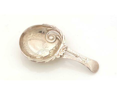 A George III silver caddy spoon, small with engraved and bifurcated stem, the bowl with shell and scrolls in low relief, an e