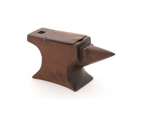 A 19th Century treen snuff box, in the form of an anvil with flush-hinged cover, 11cms long.