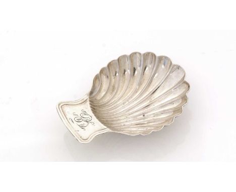 A George III silver Provincial caddy spoon, resembling a scallop shell, initialled "E", by Daniel Holy &amp; Co., Sheffield 1