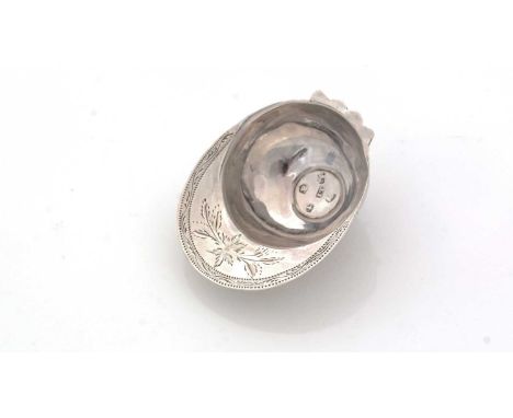 A George III silver "jockey cap" caddy spoon, with an engraved peak and pricked borders to simulate stitching, initialled "JM