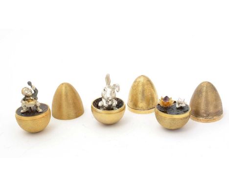 Three Elizabeth II silver and parcel-gilt surprise eggs, each with textured finish, one with a cast hare interior (No. 74), o