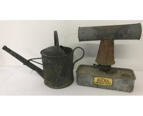 A vintage galvanised 1 gallon watering can together with an Eltex Greenhouse heater.  