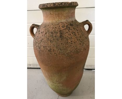 A large vintage terracotta 2-handled garden urn.  Approx. 70cm tall.