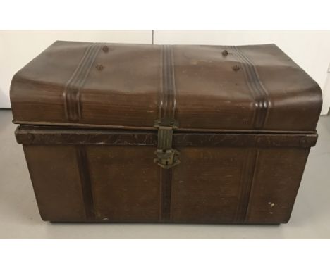 A large vintage tin trunk with painted woodgrain design and original catch.  Approx. 46cm tall, W75cm, D52cm.