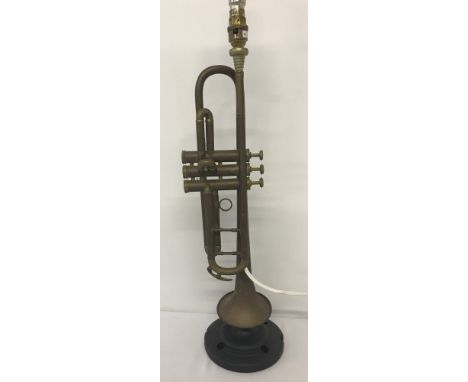 A vintage table lamp in the form of a trumpet. Without shade. Approx. 64cm tall