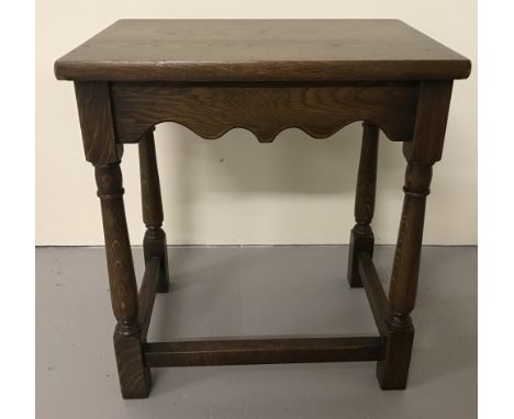 A vintage wooden side table with turned legs and scalloped detail.  Approx 41cm x 30cm x 45cm tall
