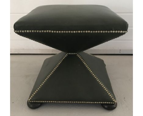 A vintage square shaped dark green leather footstool with studded detail on wooden bun feet.  Approx. 48cm tall x 49cm wide.