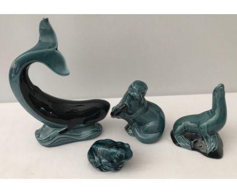 4 ceramic animal figurines by Poole Pottery with blue/green glaze. Comprising: otter, seal, frog and whale. Largest piece app