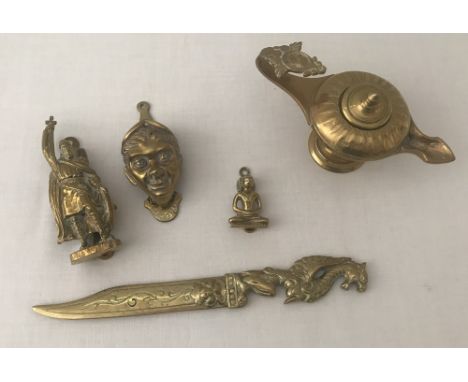 3 brass vintage door knockers together with a dagger letter opener and a genie's lamp. Door knockers comprise oriental deity,